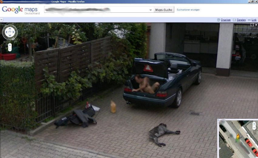 a naked man in the trunk of a car